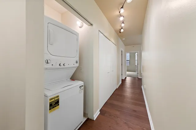 a view of a hallway with washer and dryer