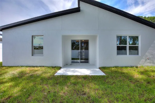 a view of a backyard of the house