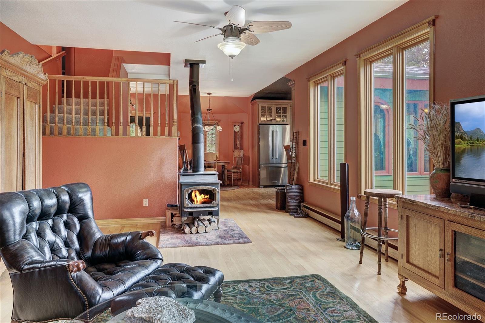 644 Spruce Creek Road Breckenridge, CO 80424 - Photo 17 of 42 a living room with furniture and a flat screen tv