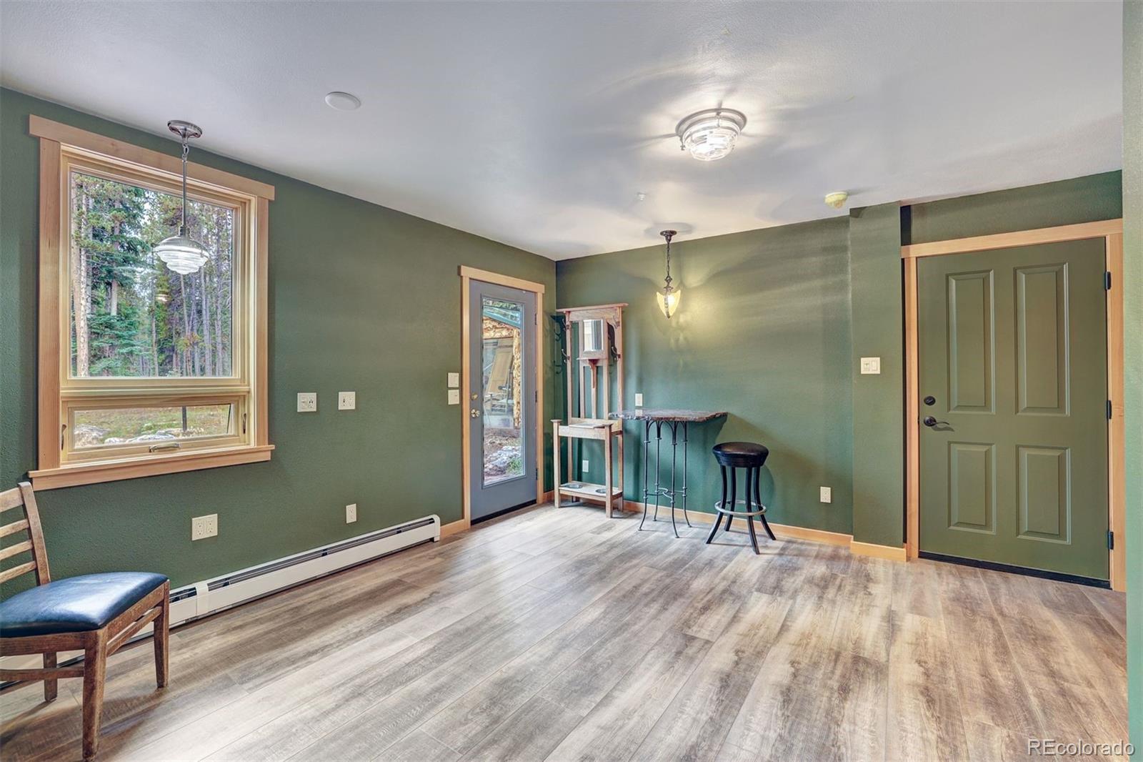 644 Spruce Creek Road Breckenridge, CO 80424 - Photo 18 of 42 a view of a room with furniture window and wooden floor