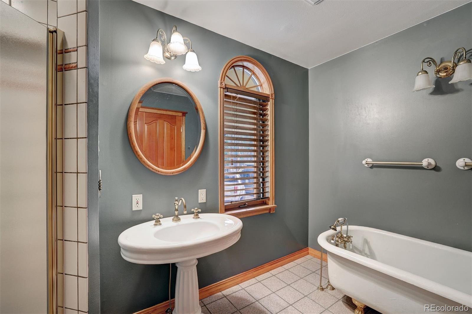 644 Spruce Creek Road Breckenridge, CO 80424 - Photo 21 of 42 a bathroom with a sink and a mirror