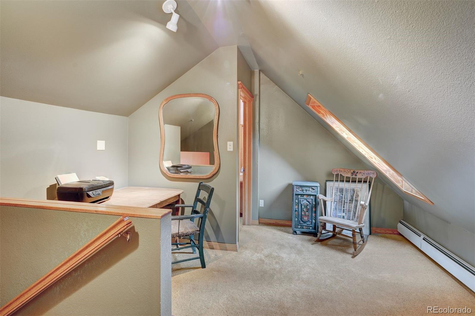 644 Spruce Creek Road Breckenridge, CO 80424 - Photo 22 of 42 a room with a table and chairs