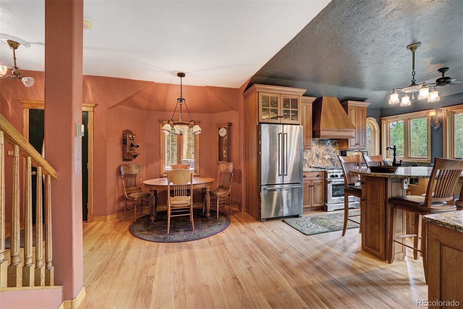 644 Spruce Creek Road Breckenridge, CO 80424 - Photo 9 of 42 a view of a dining room with furniture window and wooden floor
