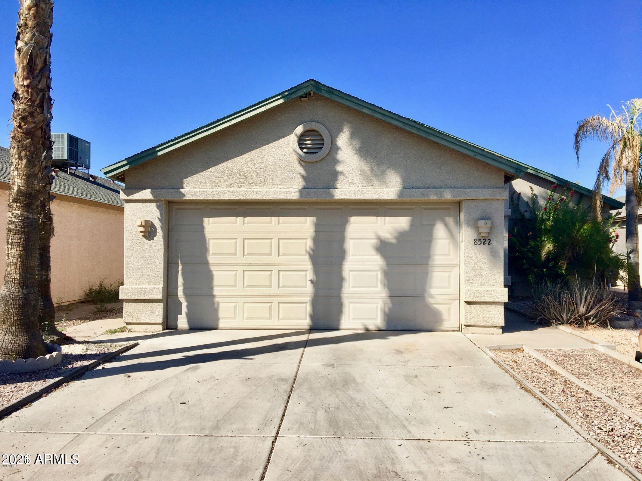 8522 West Pierson Street Phoenix, AZ 85037 - Photo 1 of 1 a front view of a house with a yard