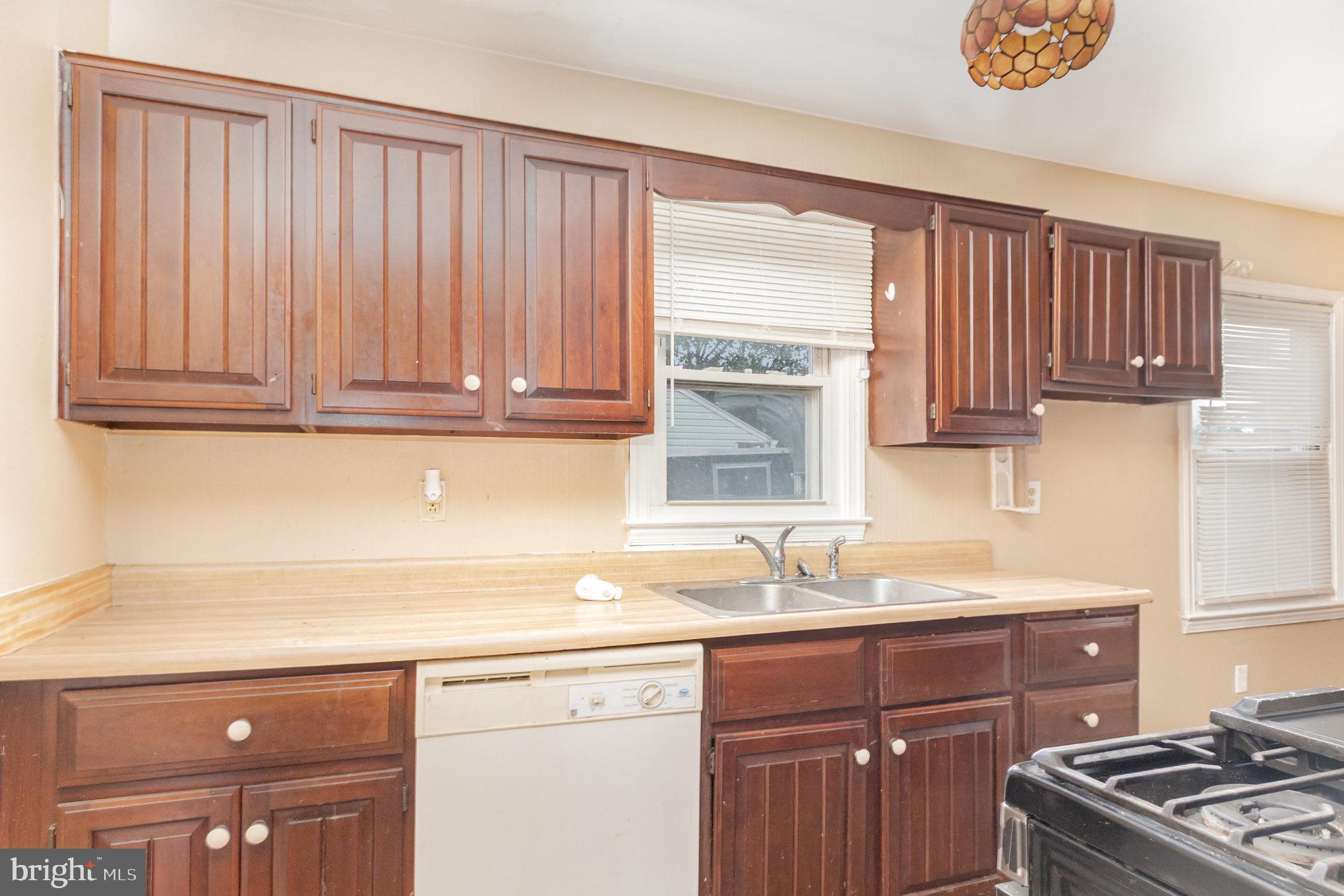 25 Mitchell Avenue Aberdeen, MD 21001 - Photo 11 of 26 a kitchen with stainless steel appliances granite countertop a sink stove and cabinets