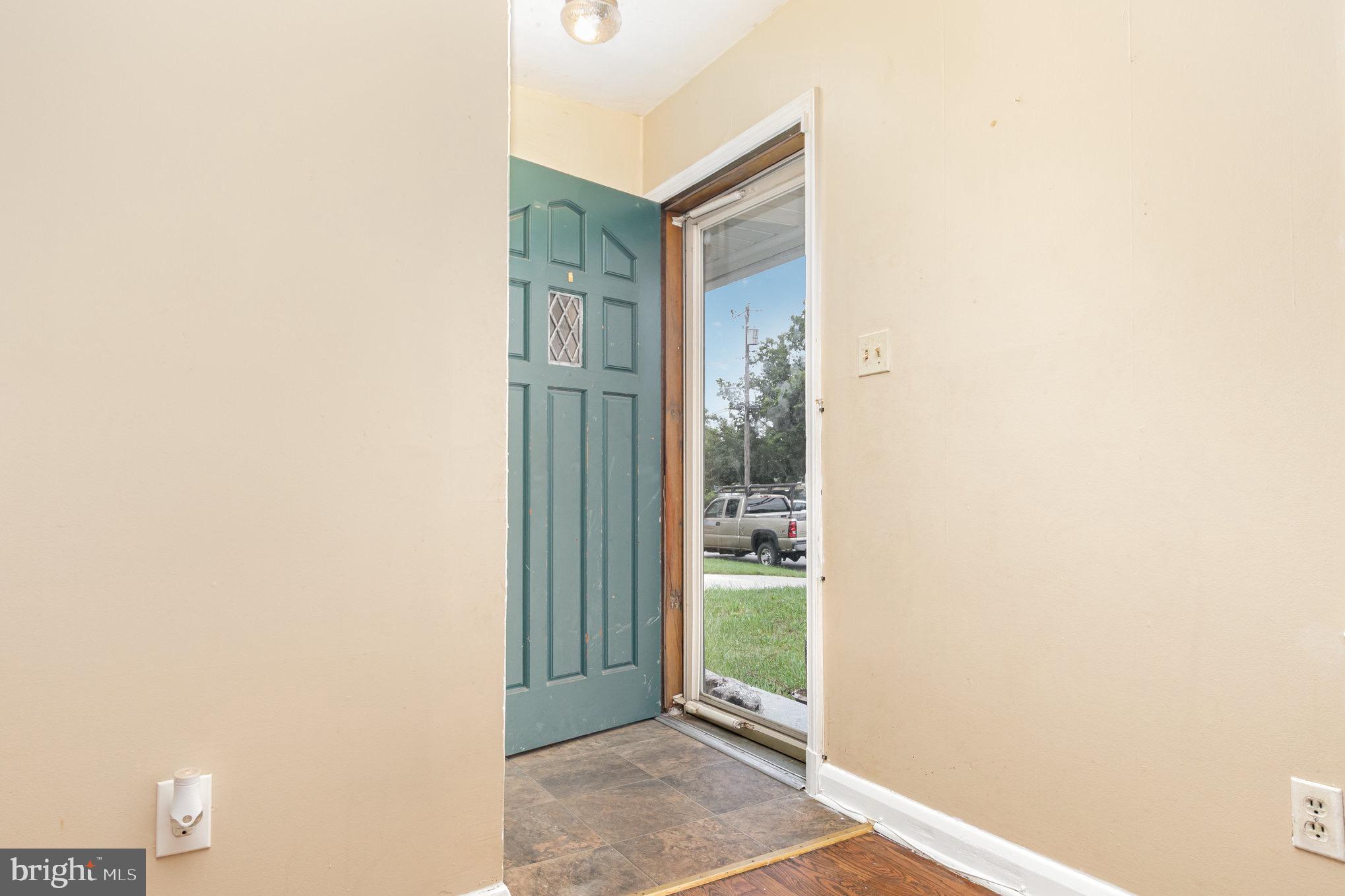 25 Mitchell Avenue Aberdeen, MD 21001 - Photo 17 of 26 a view of a room that has a door and a plant