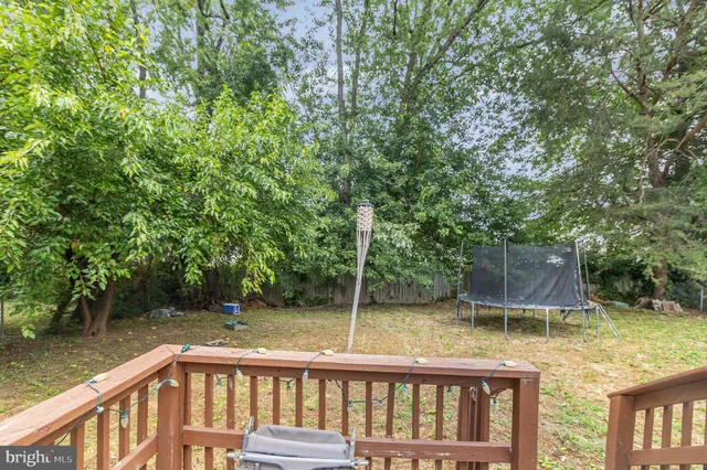 a view of a chair and table in the balcony