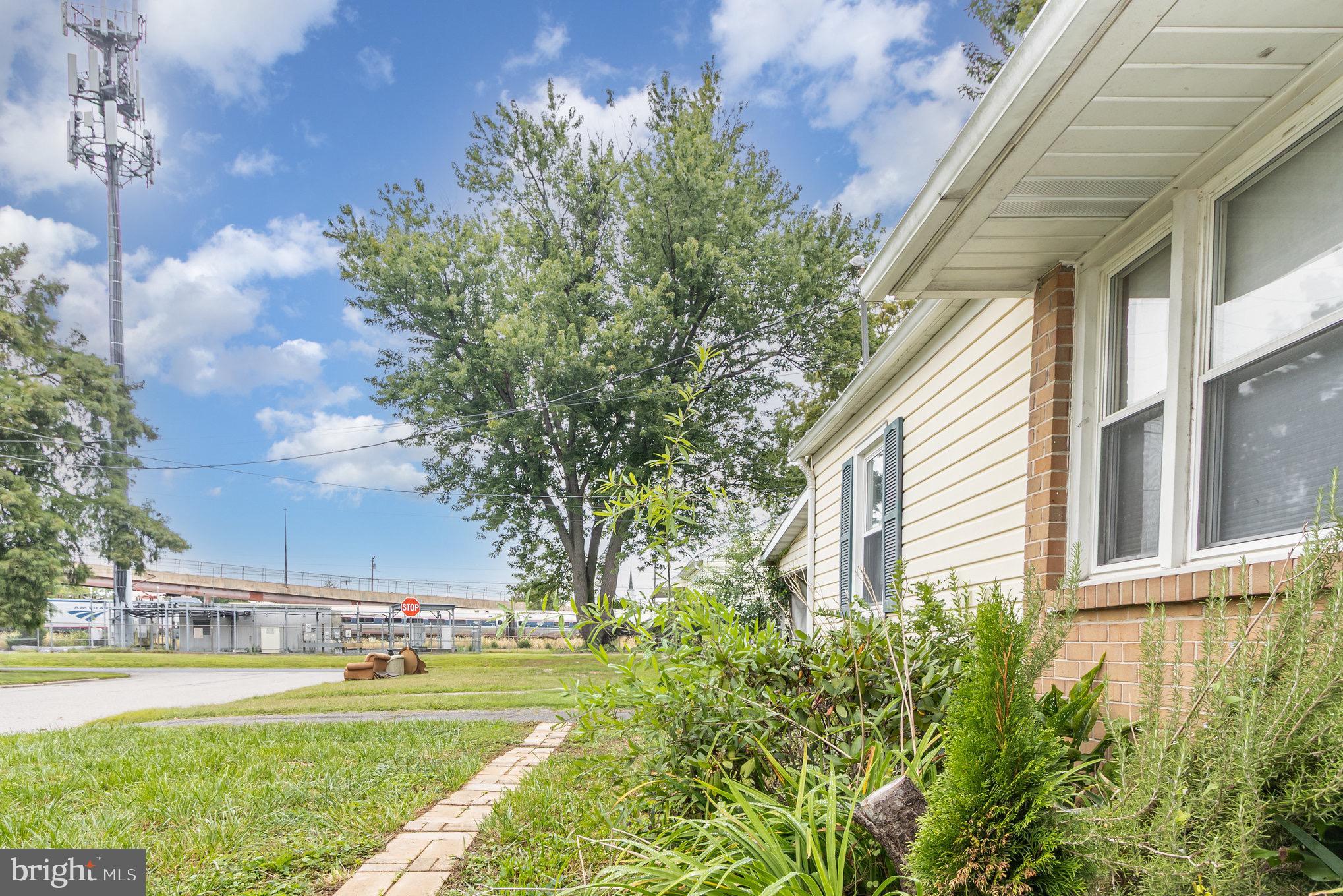 25 Mitchell Avenue Aberdeen, MD 21001 - Photo 4 of 26 a view of a yard with plants and trees