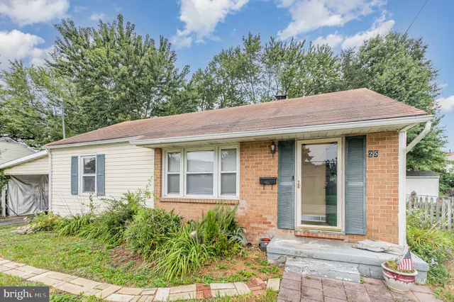 a view of a hallway with a chandelier fan and wooden floor