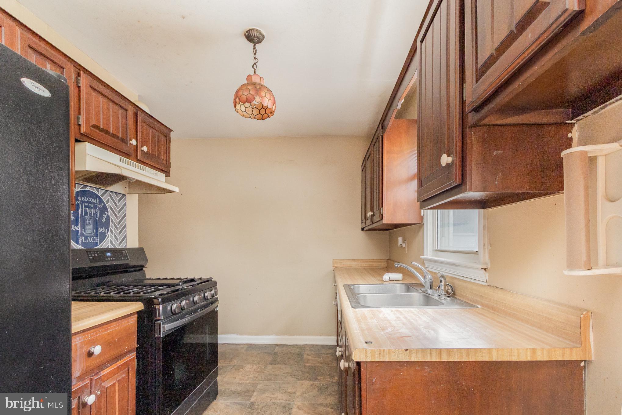 25 Mitchell Avenue Aberdeen, MD 21001 - Photo 10 of 26 a kitchen with a stove and a sink