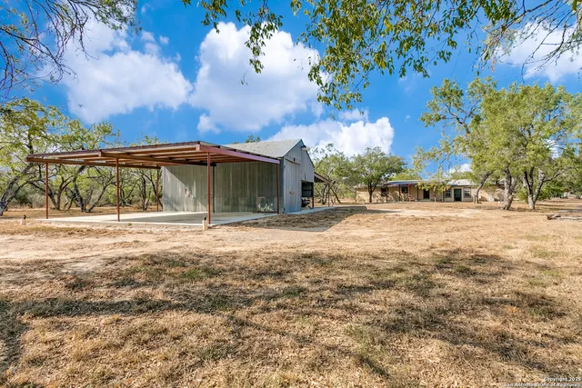 a view of backyard with green space