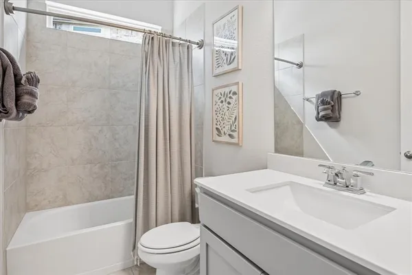 a bathroom with a sink a toilet and a bathtub