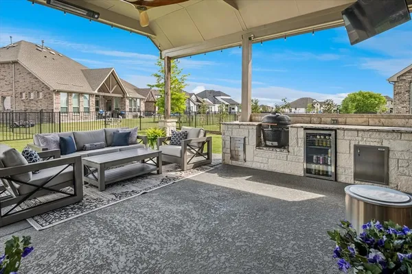a patio with patio a couch and chairs