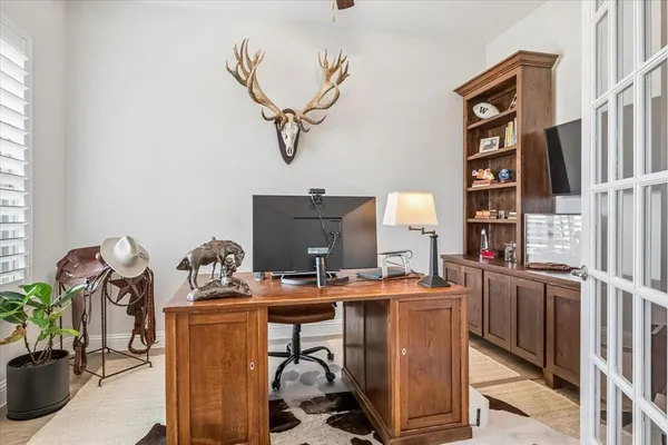 a room with furniture a chandelier and a window
