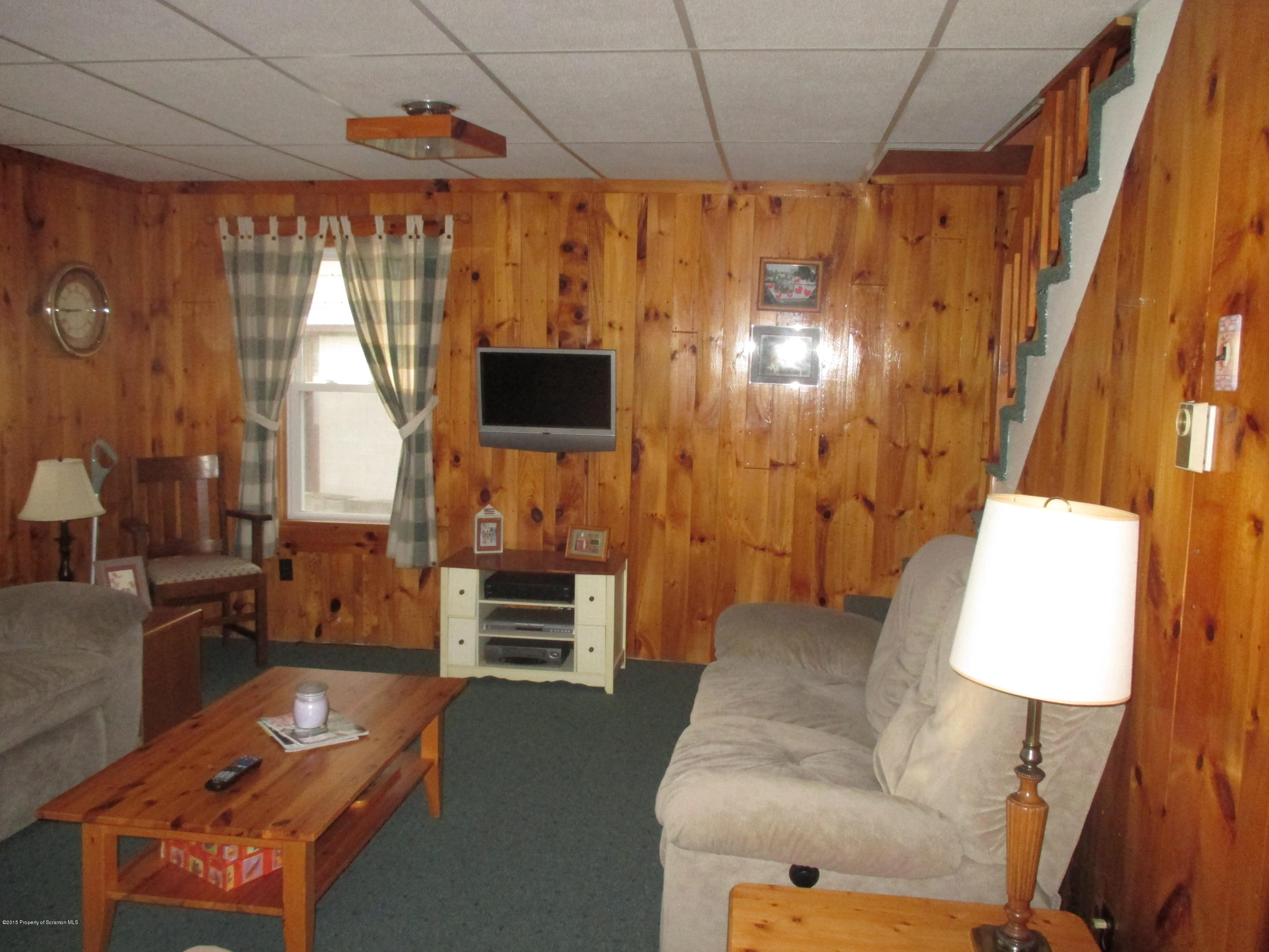 394 Point Road Lake Winola, PA 18419 - Photo 12 of 28 a living room with furniture and a flat screen tv