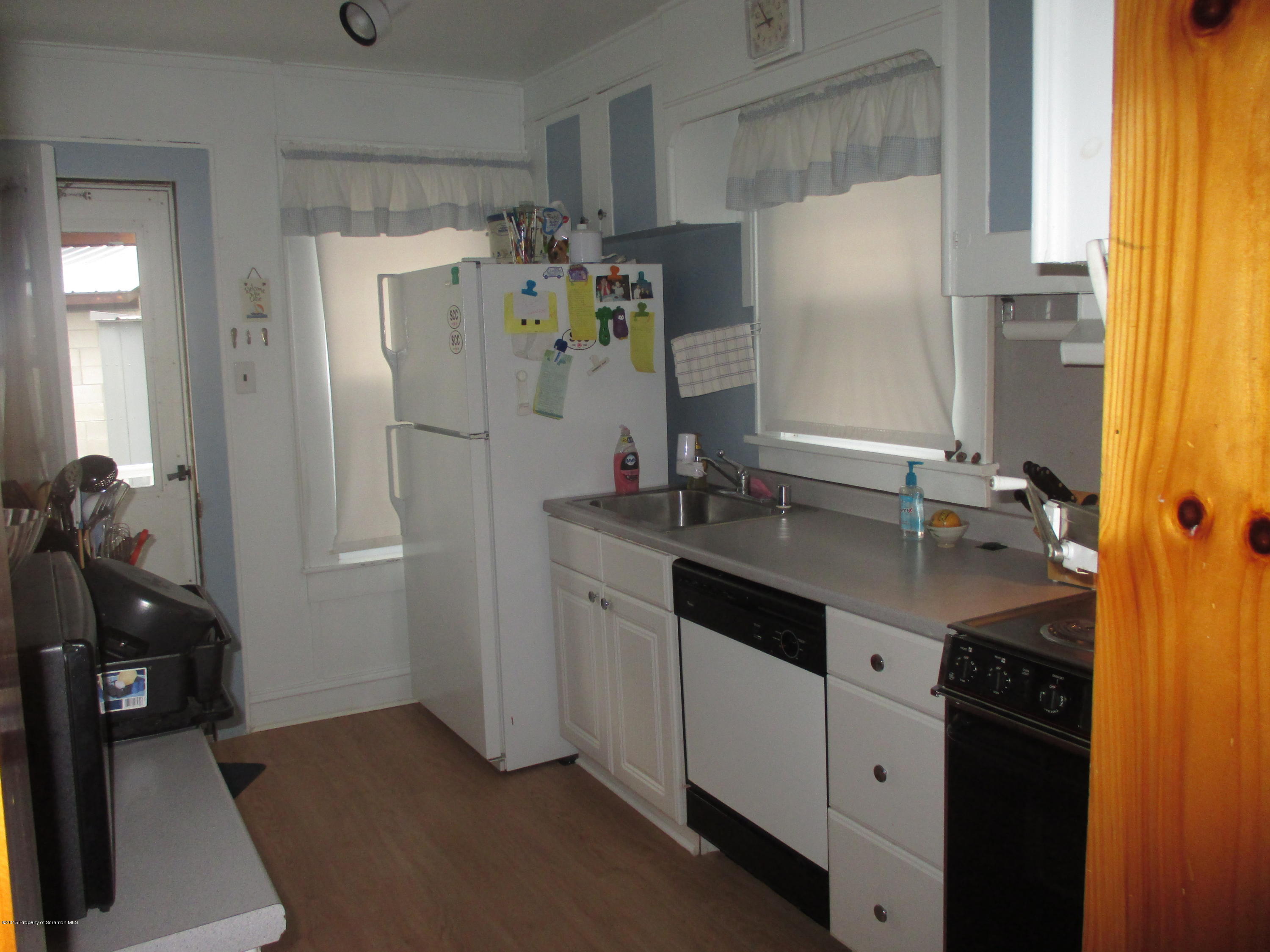 394 Point Road Lake Winola, PA 18419 - Photo 13 of 28 a kitchen with a sink appliances and cabinets