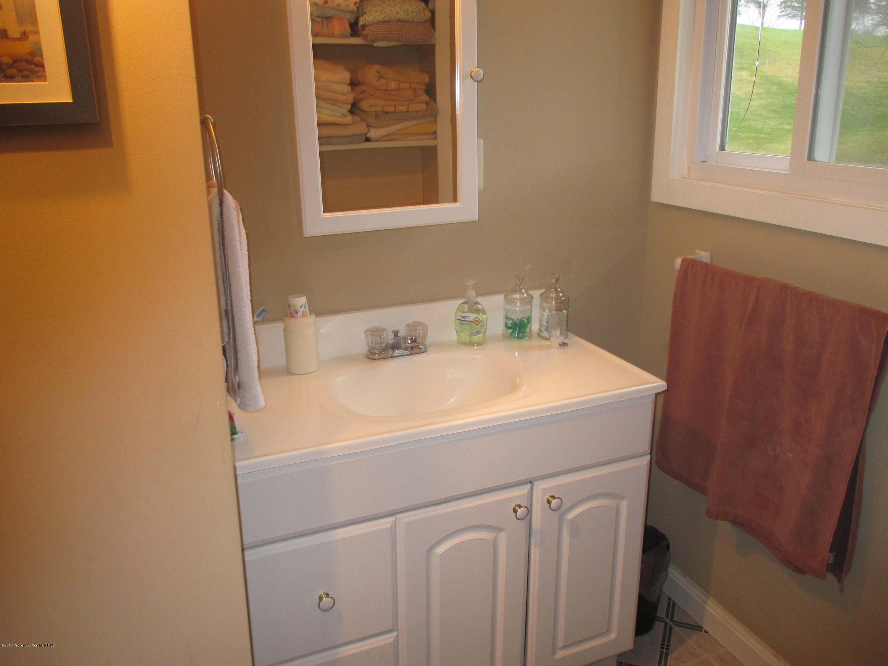394 Point Road Lake Winola, PA 18419 - Photo 22 of 28 a bathroom with a sink and a vanity