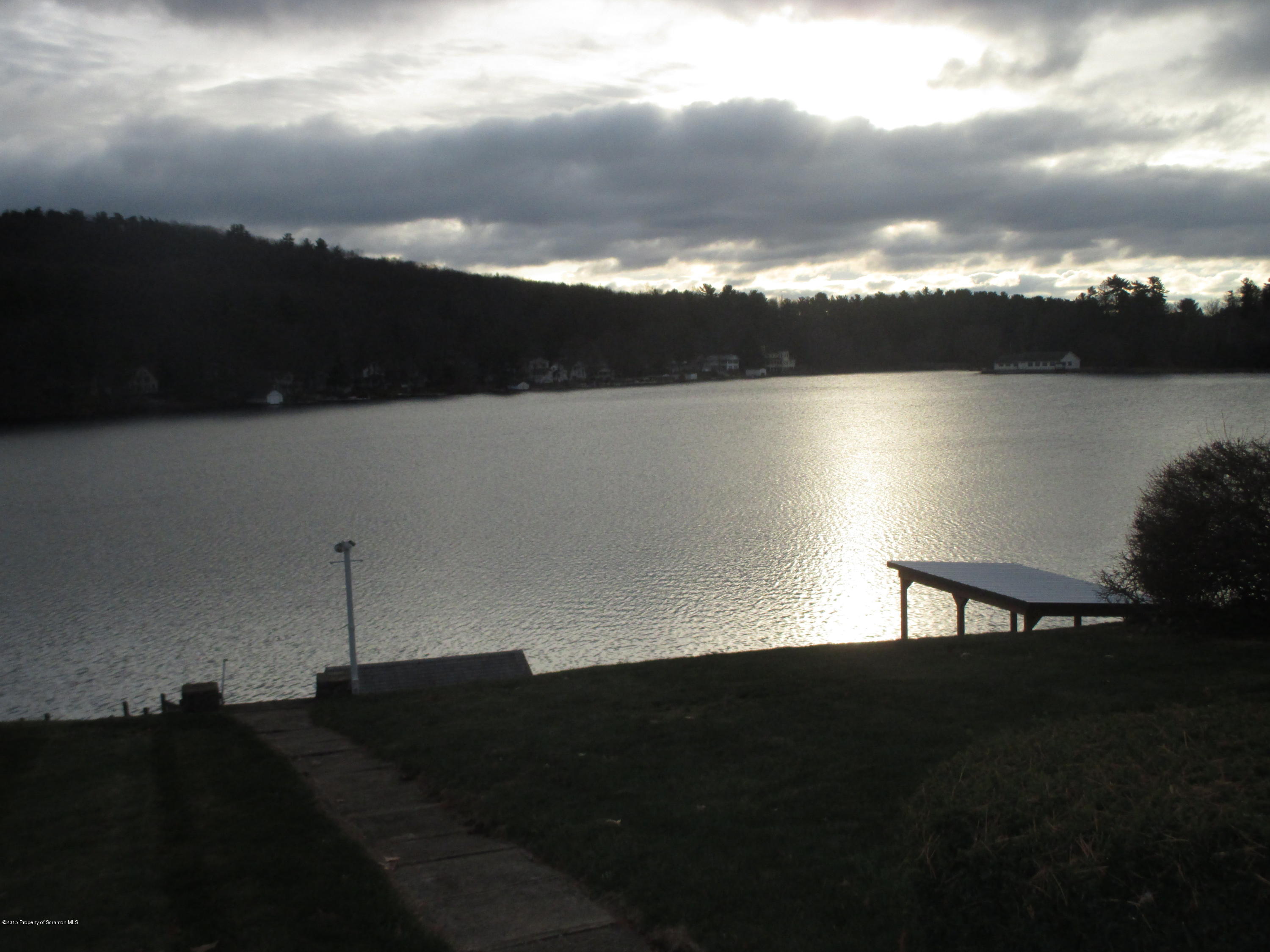 394 Point Road Lake Winola, PA 18419 - Photo 6 of 28 a view of a lake in middle of forest