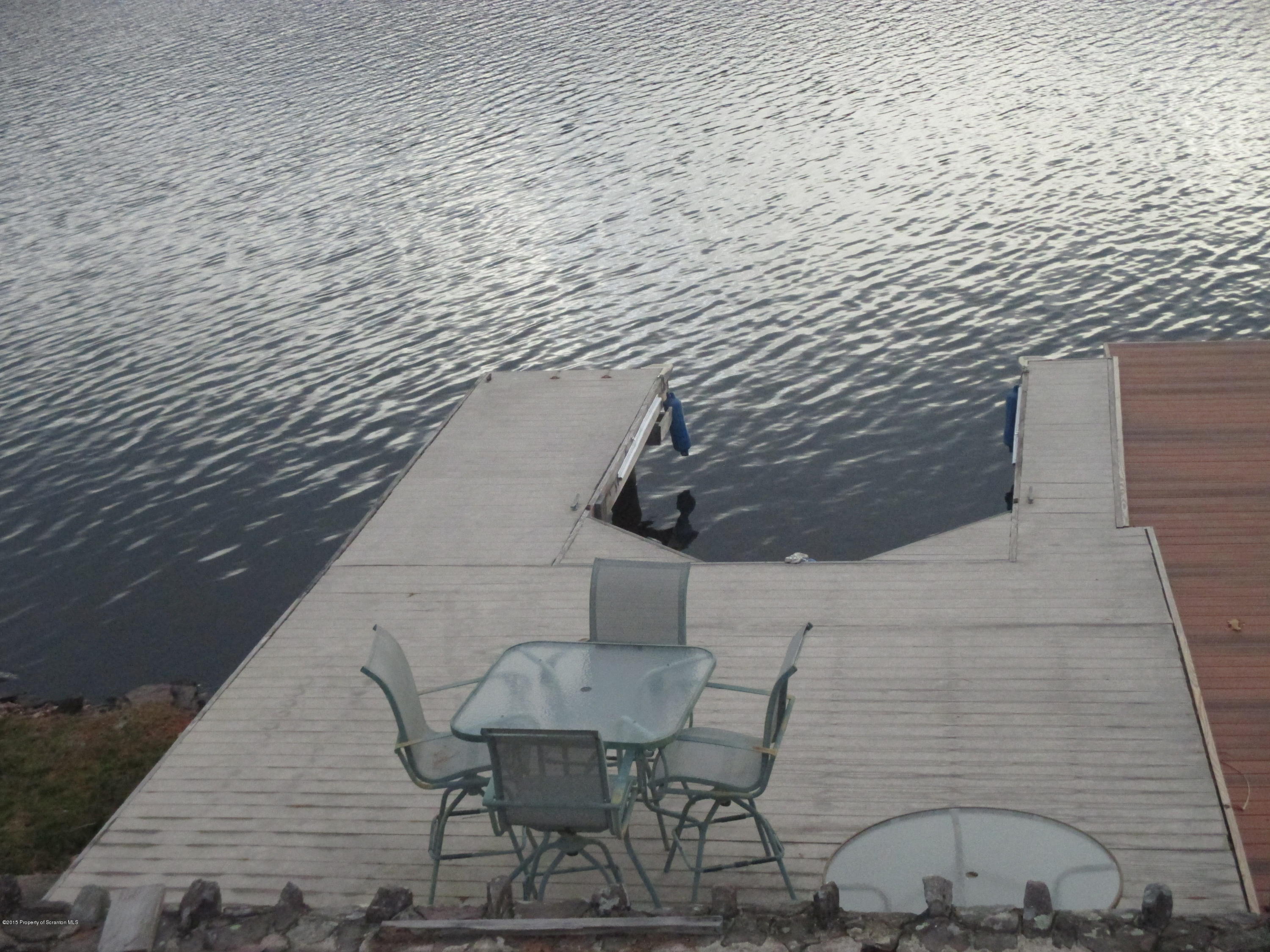 394 Point Road Lake Winola, PA 18419 - Photo 7 of 28 a balcony with table and chairs