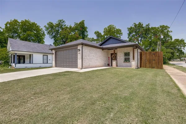 a house with trees in the background