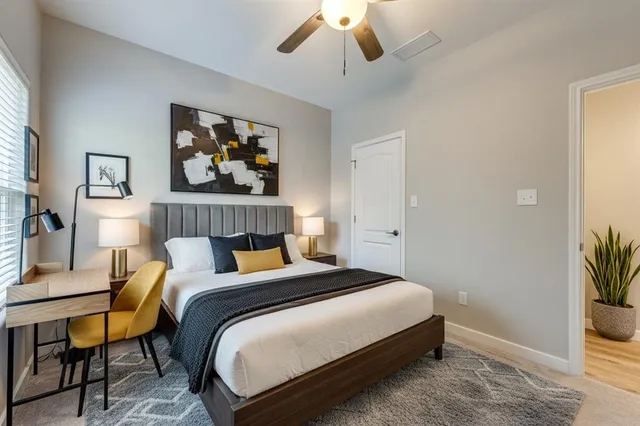 a bedroom with bed and window