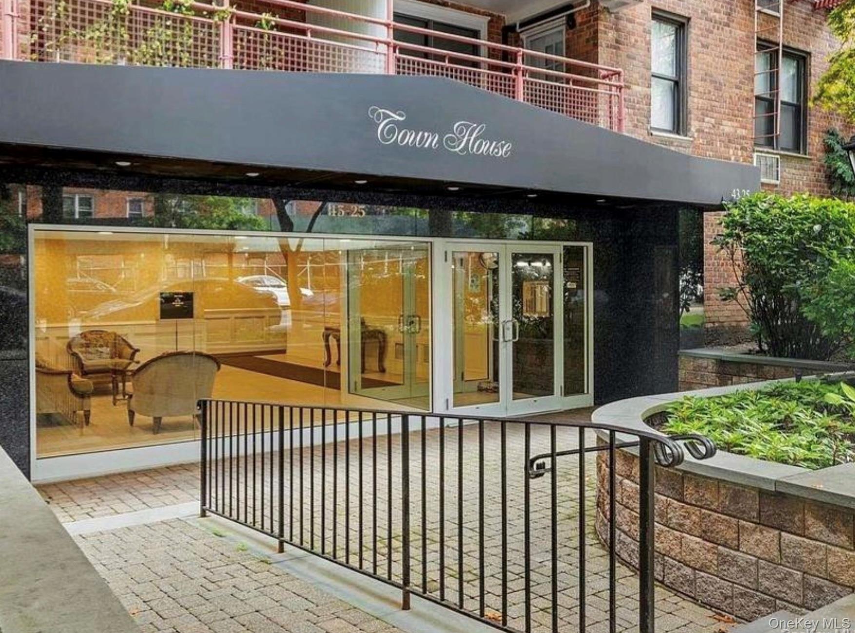 a view of a brick house with a large window