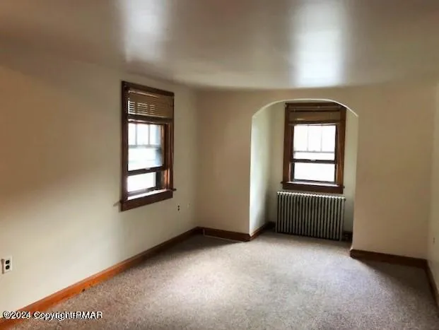 an empty room with windows