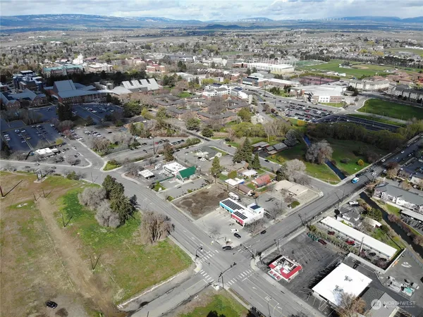 an aerial view of residential houses with outdoor space
