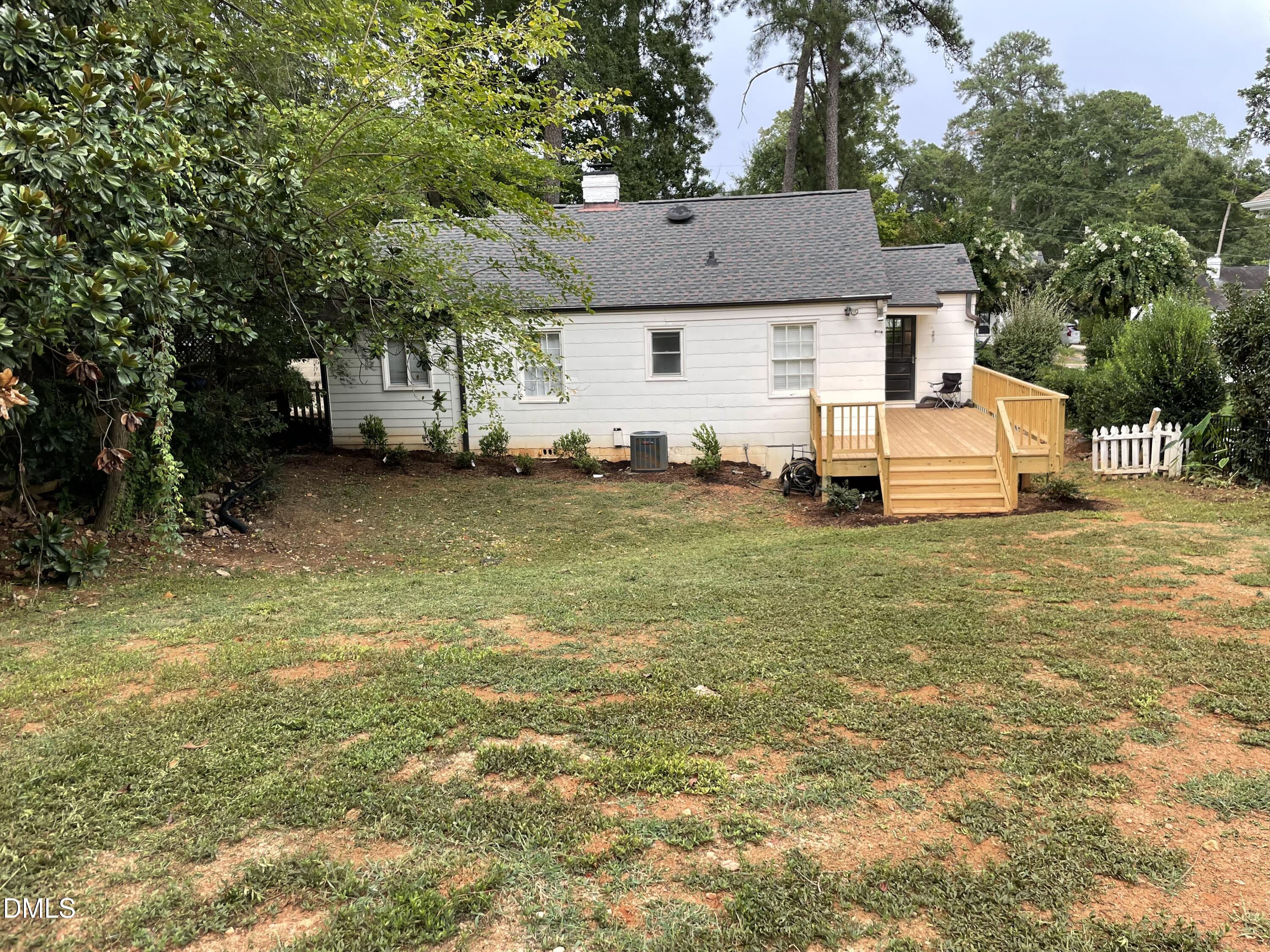 1009 Canterbury Road Raleigh, NC 27607 - Photo 7 of 31 a view of a house with a yard
