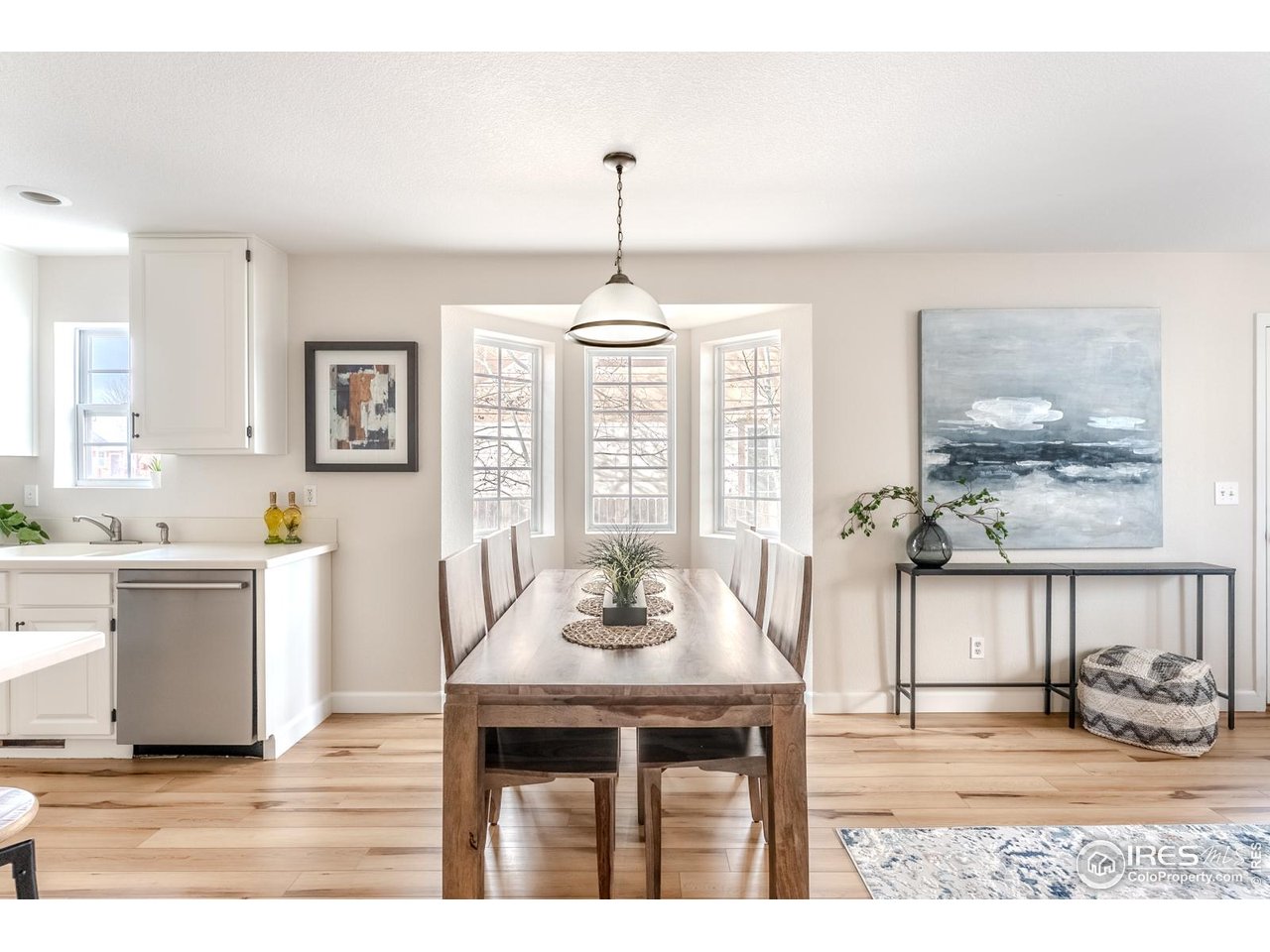 502 Ridge Avenue Longmont, CO 80501 - Photo 13 of 36 a dining room with wooden floor and breakfast area