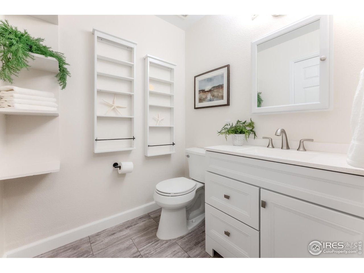 502 Ridge Avenue Longmont, CO 80501 - Photo 22 of 36 a bathroom with a sink toilet and shower
