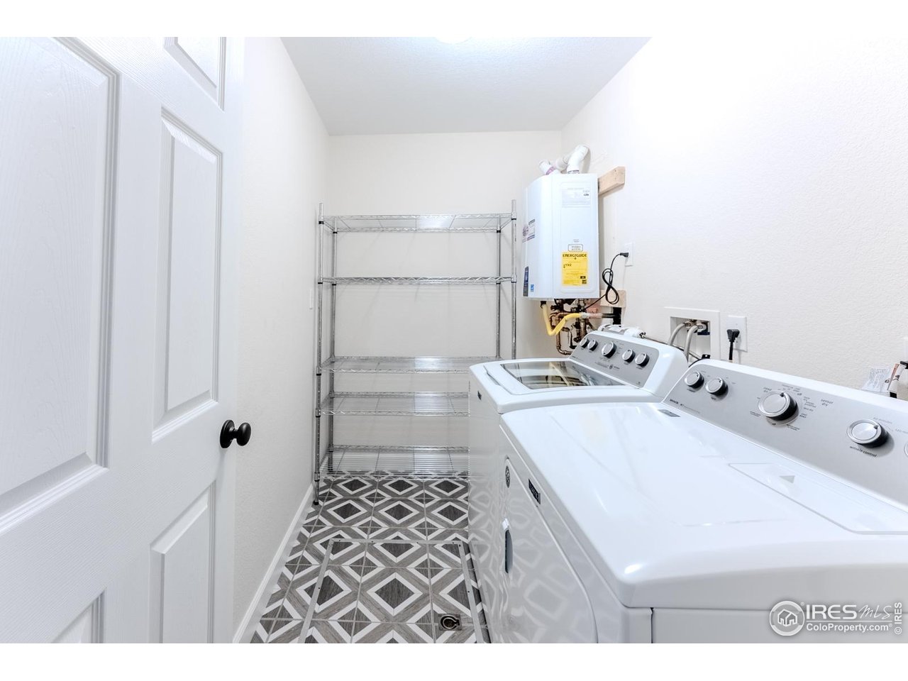 502 Ridge Avenue Longmont, CO 80501 - Photo 28 of 36 a bathroom with a sink a mirror and shower