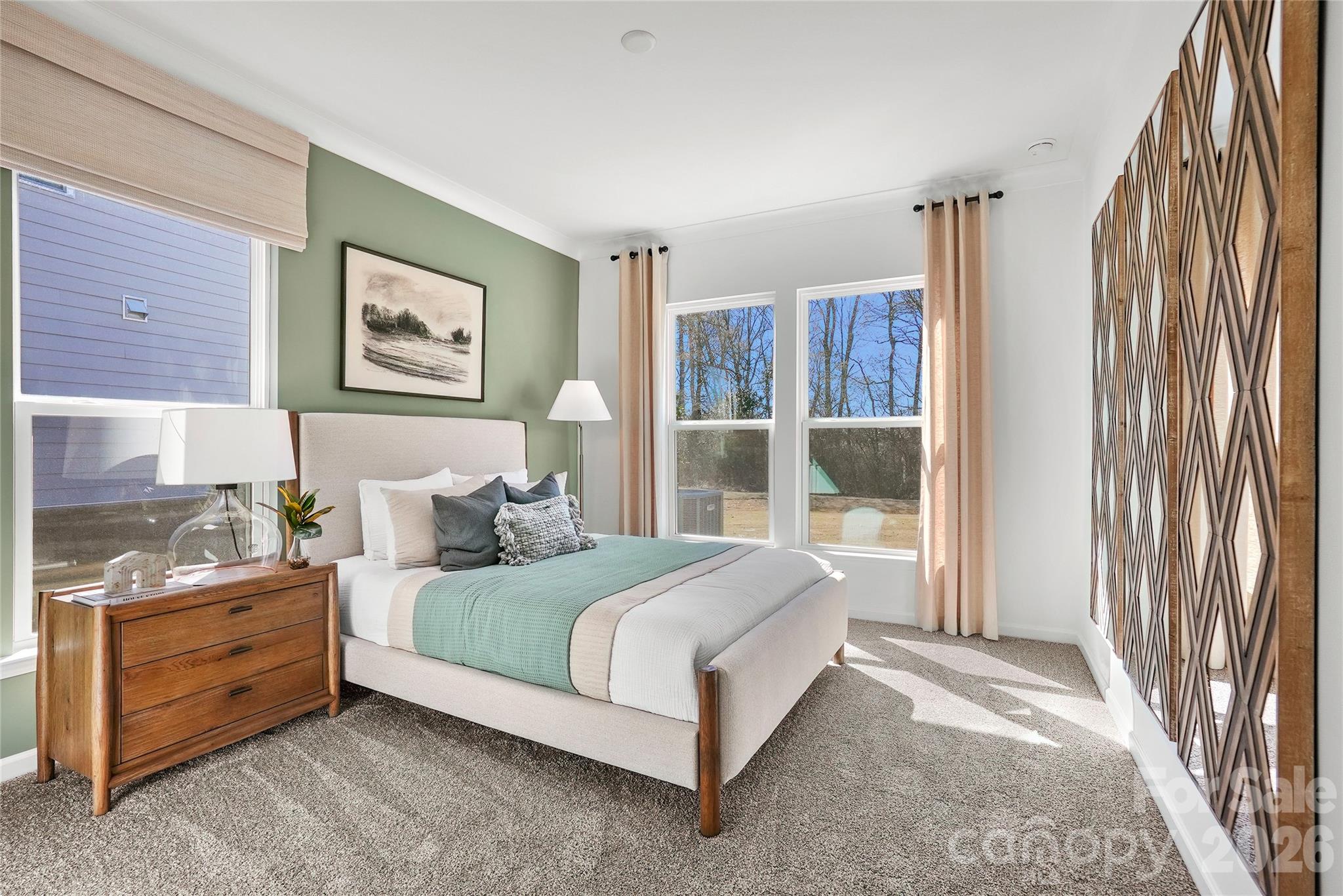 2168 Rone Branch Trail Monroe, NC 28110 - Photo 12 of 22 a bedroom with a bed lamp and a large window