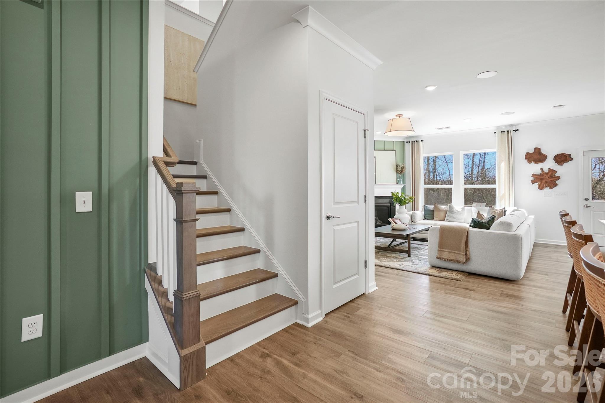2168 Rone Branch Trail Monroe, NC 28110 - Photo 13 of 22 a living room with furniture and a wooden floor