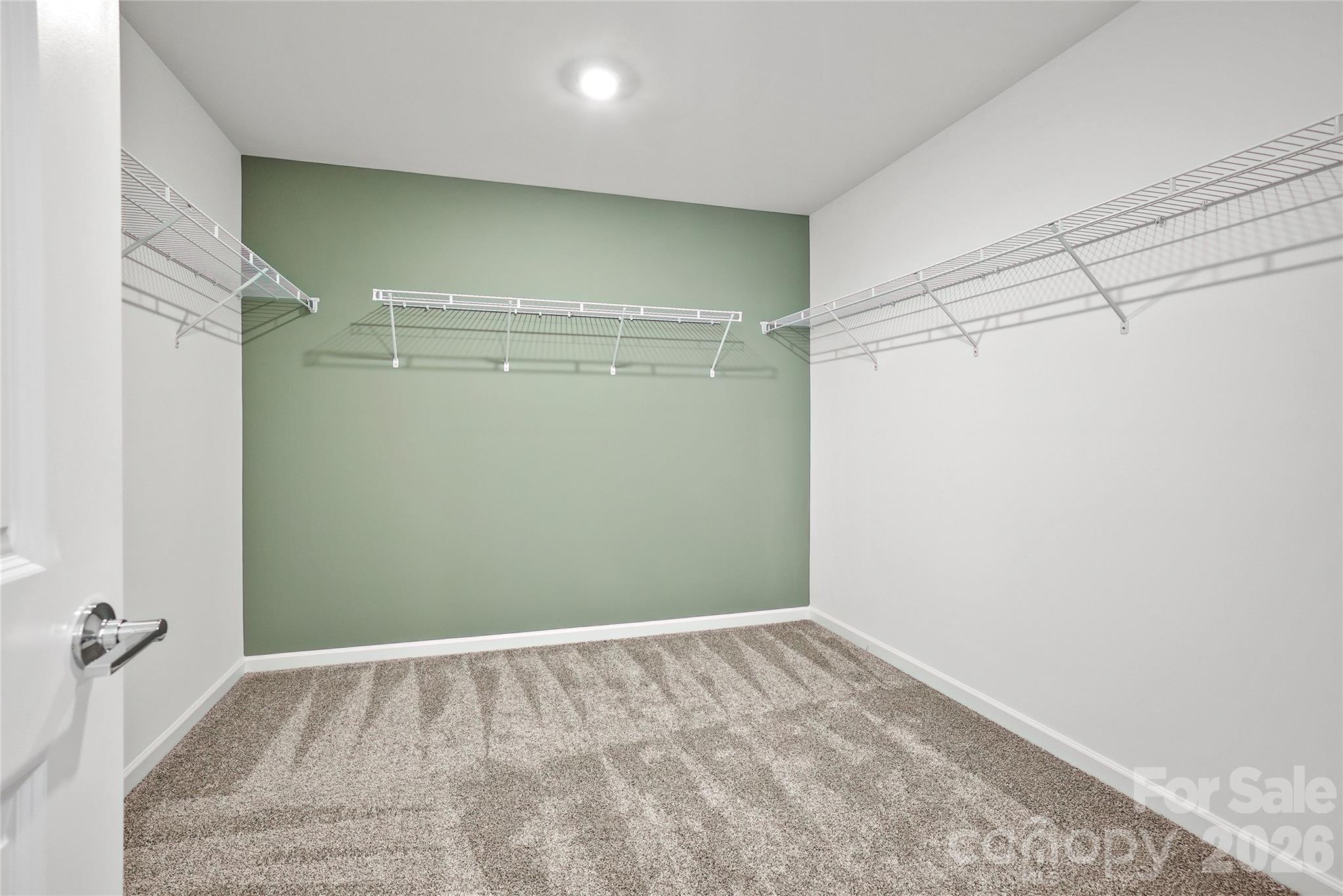 2168 Rone Branch Trail Monroe, NC 28110 - Photo 21 of 22 a view of a room with racks on the wall