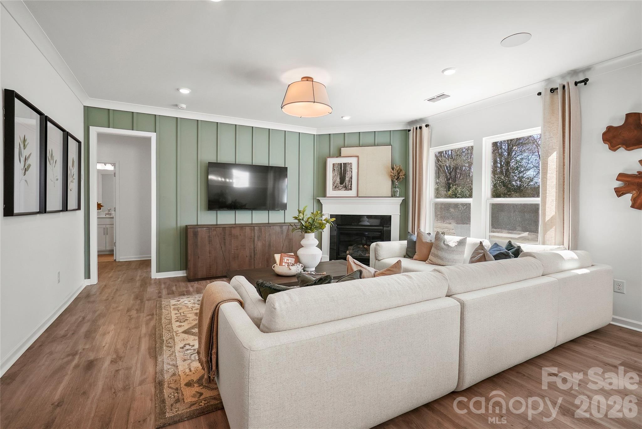 2168 Rone Branch Trail Monroe, NC 28110 - Photo 9 of 22 a living room with furniture fireplace and a flat screen tv