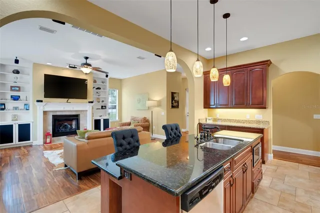 a living room with fireplace furniture and a flat screen tv
