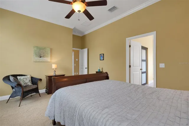 a bedroom with a bed and chair