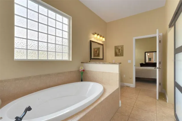 a bathroom with a bathtub and a sink