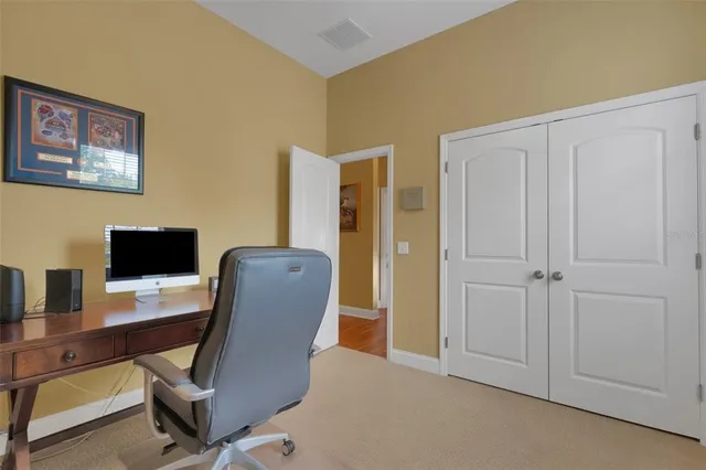 a view of a workspace with furniture and a couch