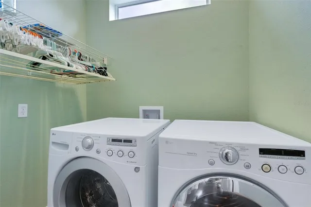 a utility room with dryer and washer
