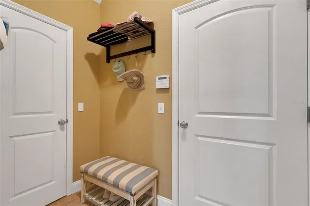 a bathroom with a shower and a mirror
