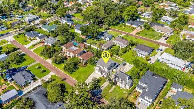 an aerial view of a house with a garden
