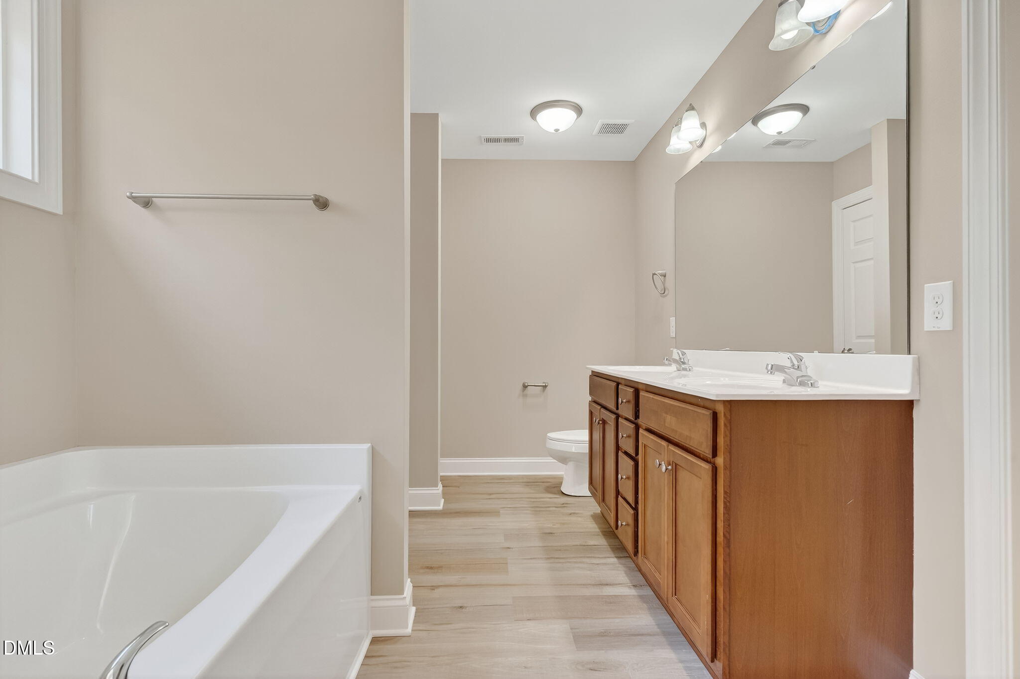 118 Landlocked Circle Angier, NC 27501 - Photo 14 of 27 a bathroom with a tub sink and mirror