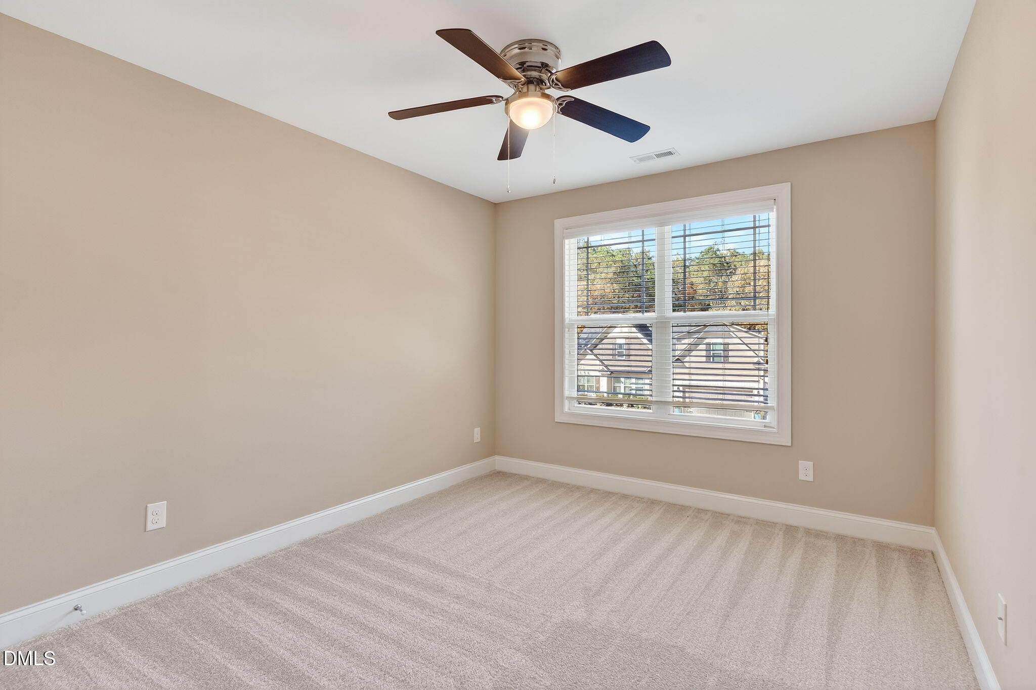 118 Landlocked Circle Angier, NC 27501 - Photo 16 of 27 an empty room with a window and a fan