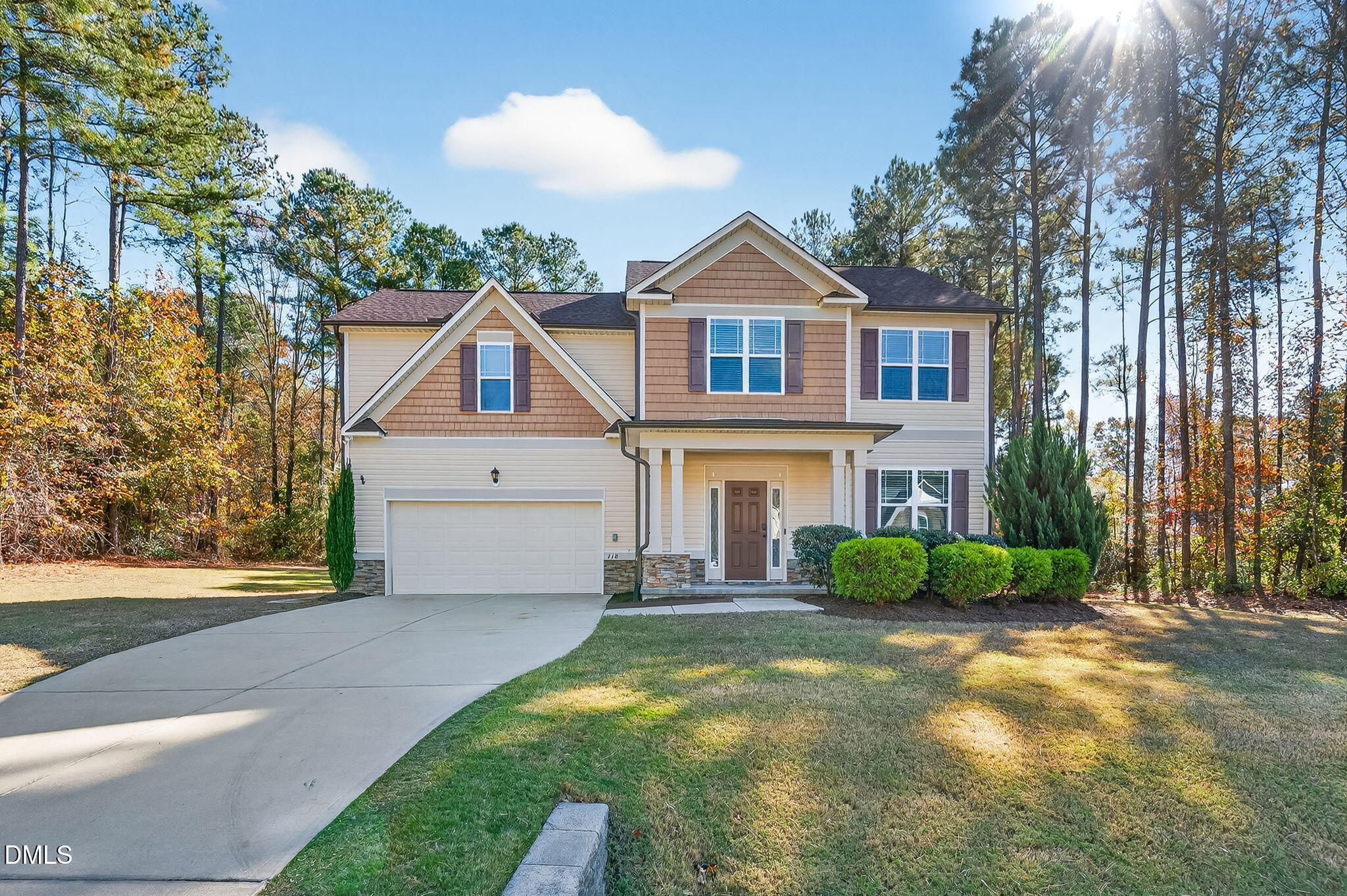 118 Landlocked Circle Angier, NC 27501 - Photo 2 of 27 a front view of a house with a yard and garage