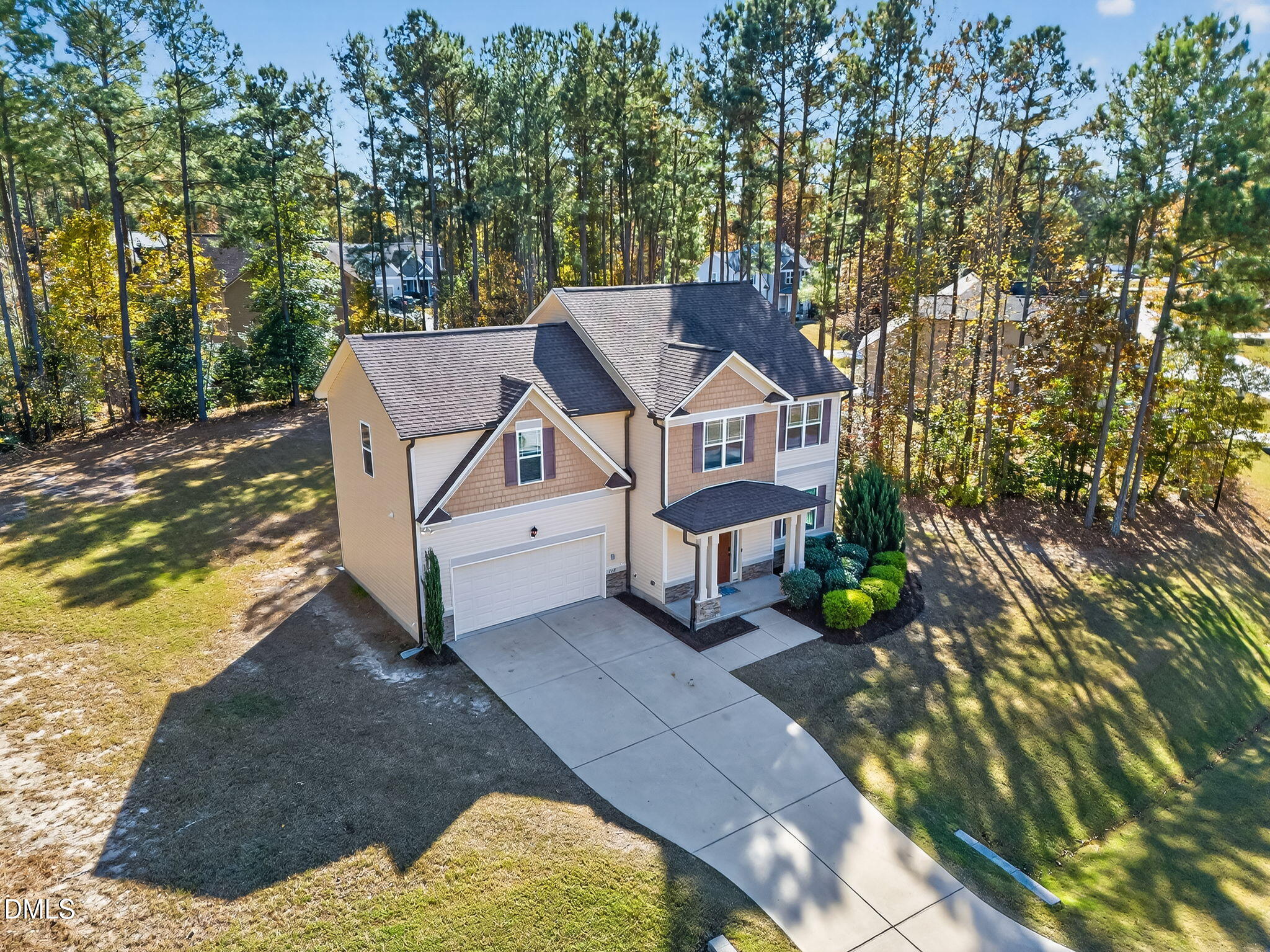 118 Landlocked Circle Angier, NC 27501 - Photo 25 of 27 a view of a patio with table and chairs with wooden fence and plants
