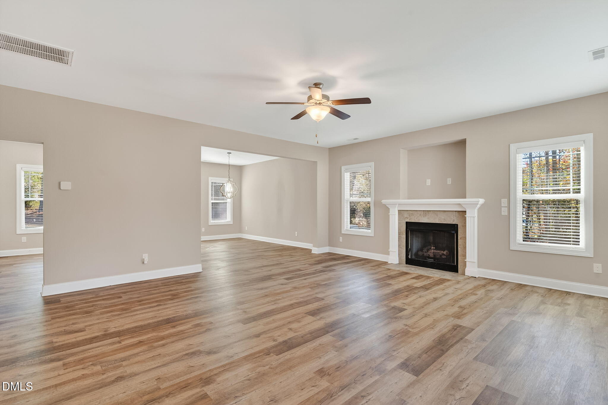 118 Landlocked Circle Angier, NC 27501 - Photo 4 of 27 a view of an empty room with window and wooden floor