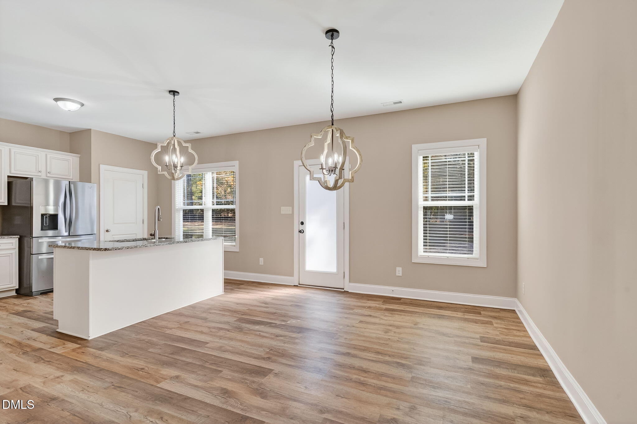 118 Landlocked Circle Angier, NC 27501 - Photo 7 of 27 a view of kitchen and kitchen with granite countertop wooden floor
