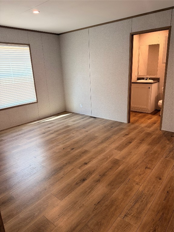 4782 Fm 1010 Road Cleveland, TX 77327 - Photo 11 of 16 a view of an empty room with wooden floor and a window